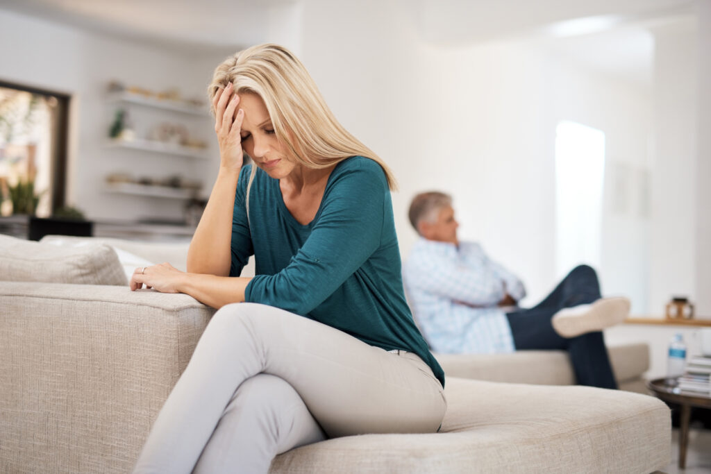 Couch, couple and fight in home for annoyed, divorce or married people for argument. Disagreement, sofa and lounge for frustrated woman, affair or emotion in toxic relationship with mature partner.